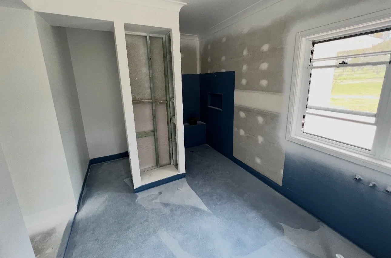 A bathroom being prepped before its micro cement finish