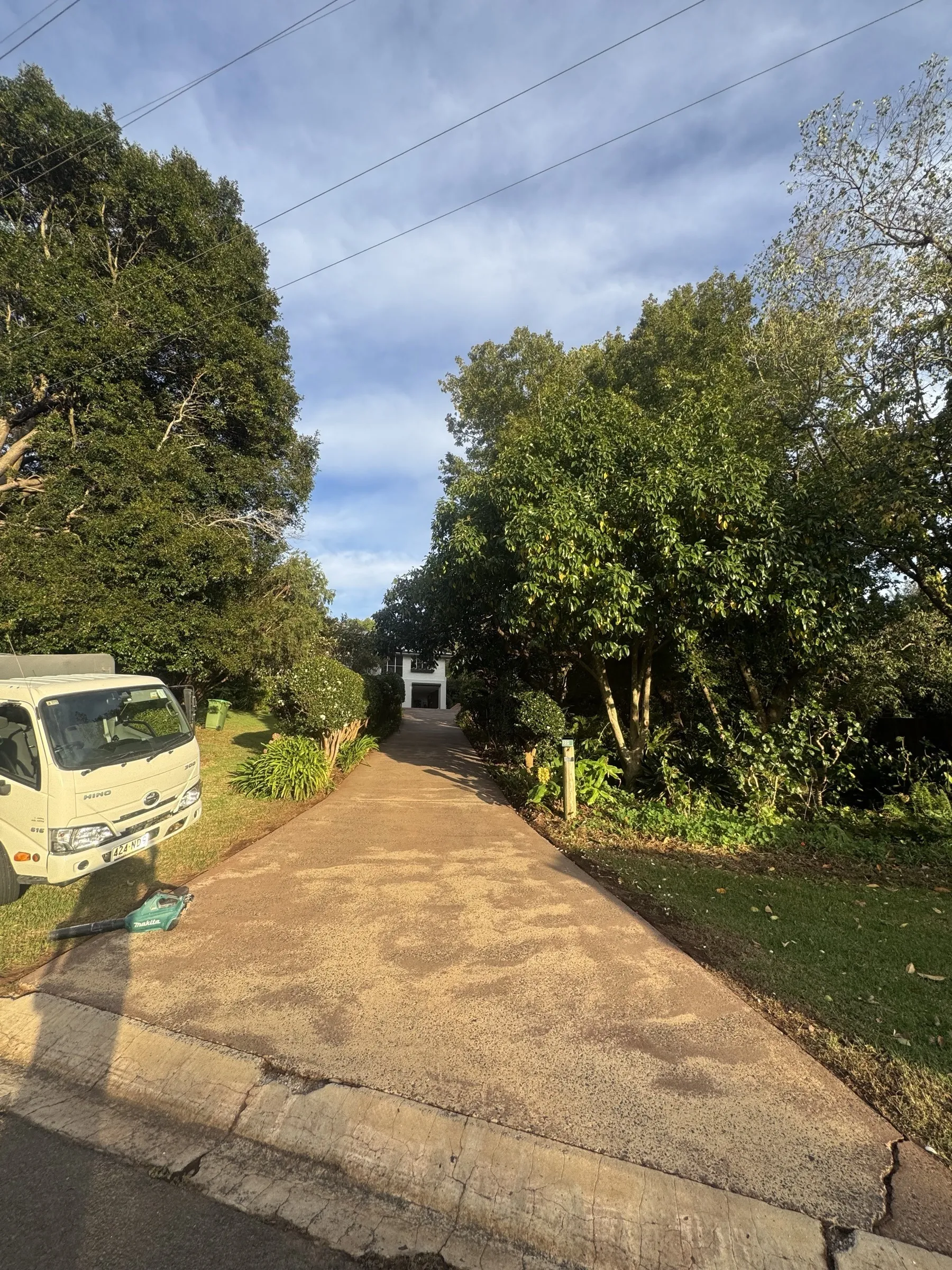 Superior Home Improvements work vehicle parked at a residential job in the Darling Downs, with established garden and residential street visible